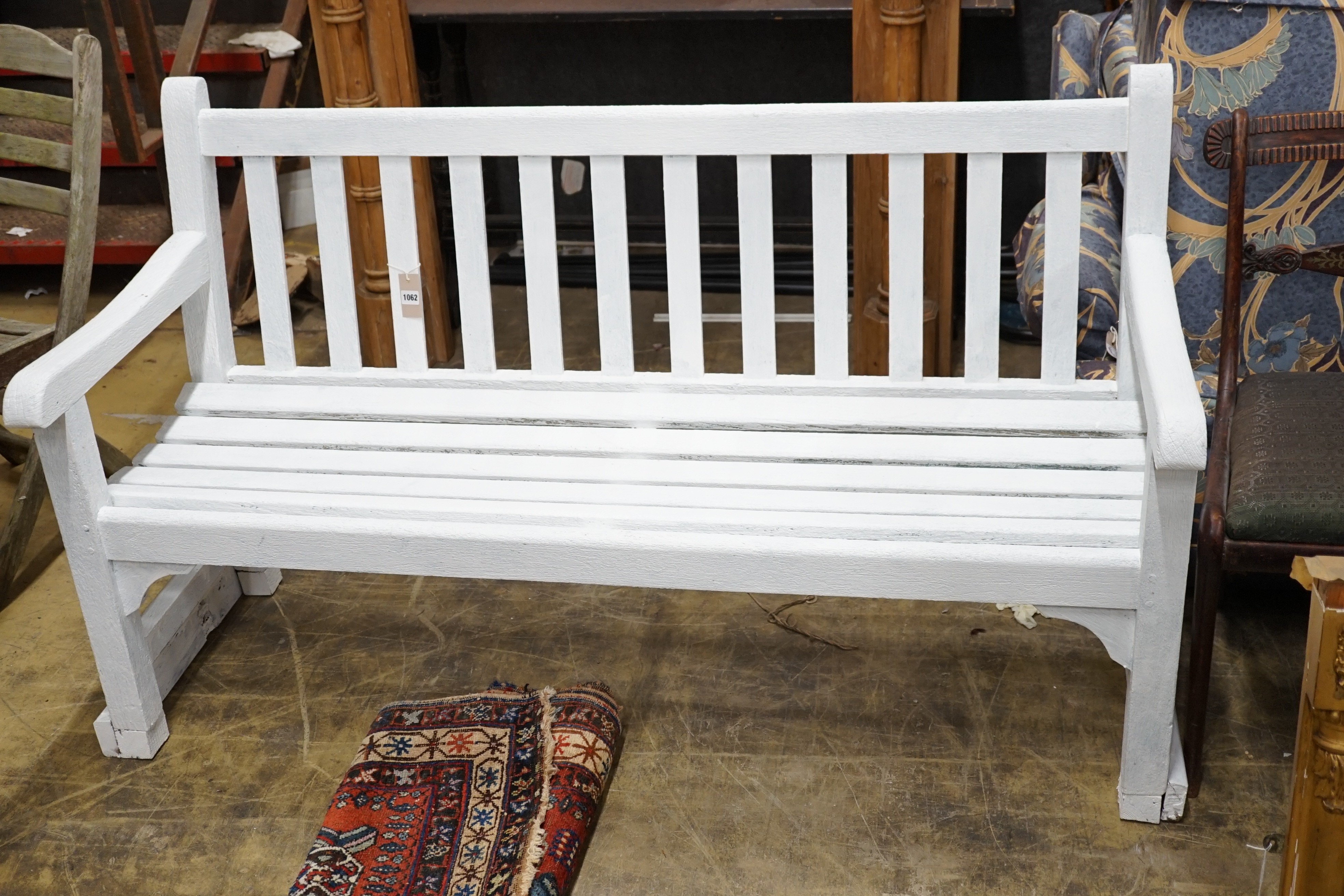A white painted hardwood garden bench, length 155cm